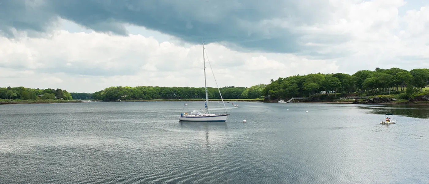 A boat in the river off the Biddeford Campus